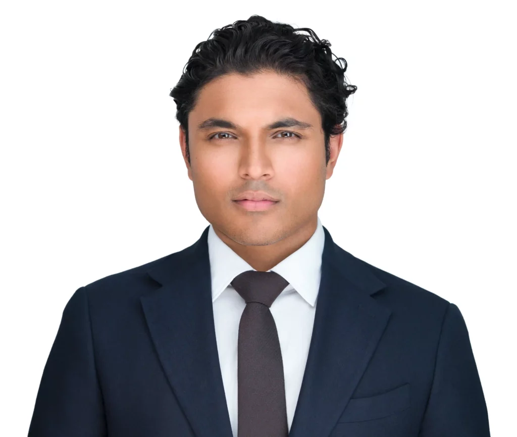 Corporate Headshot done by Corporate Headshot Photographer Headshot Specialist. Male is wearing a suit and brown tie