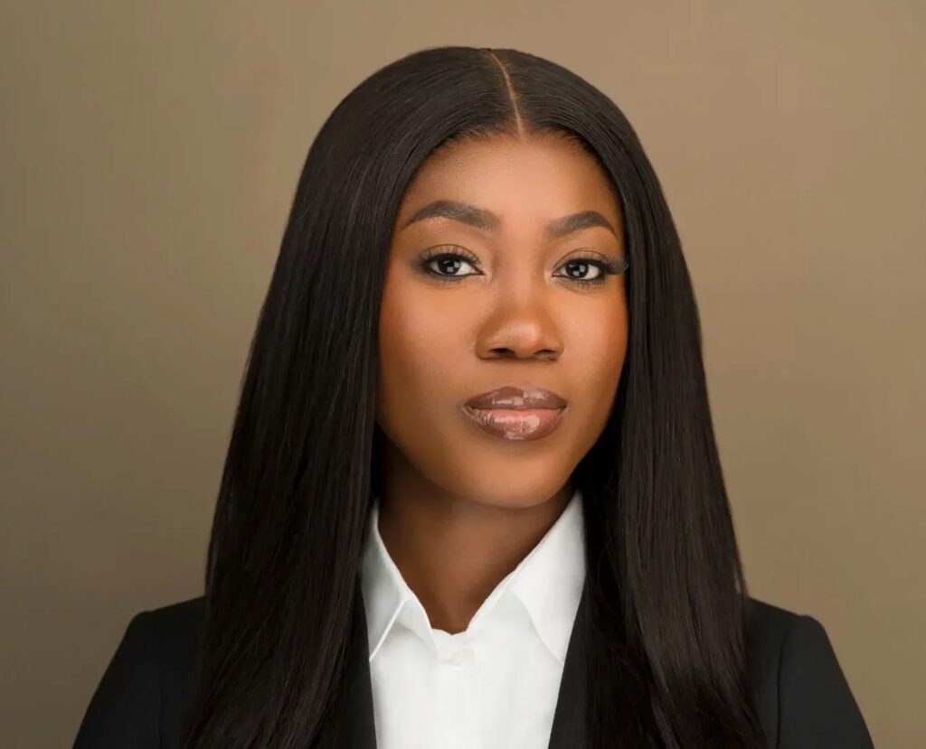 Headshot of a female executive assistant with long hair wearing a suit in NYC Headshot Photographers NYC, Headshots NYC, Headshot Photographers near me, corporate headshot