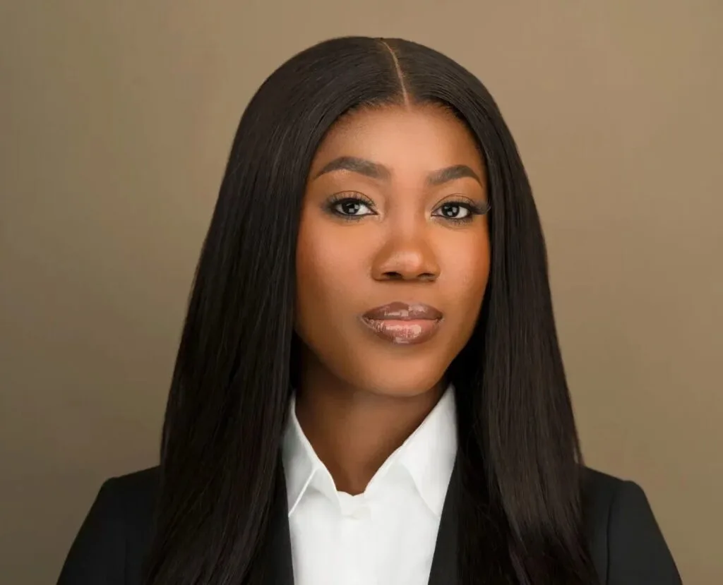 Headshot of a female executive assistant with long hair wearing a suit in NYC Headshot Photographers NYC, Headshots NYC, Headshot Photographers near me, corporate headshot
