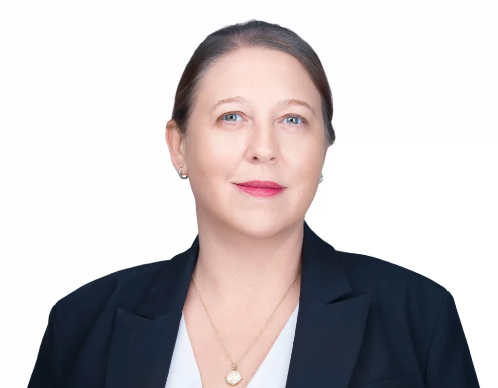Corporate Headshot done by Corporate Headshots NYC Photographer Headshot Specialist. Female is wearing a blue coat and white blouse
