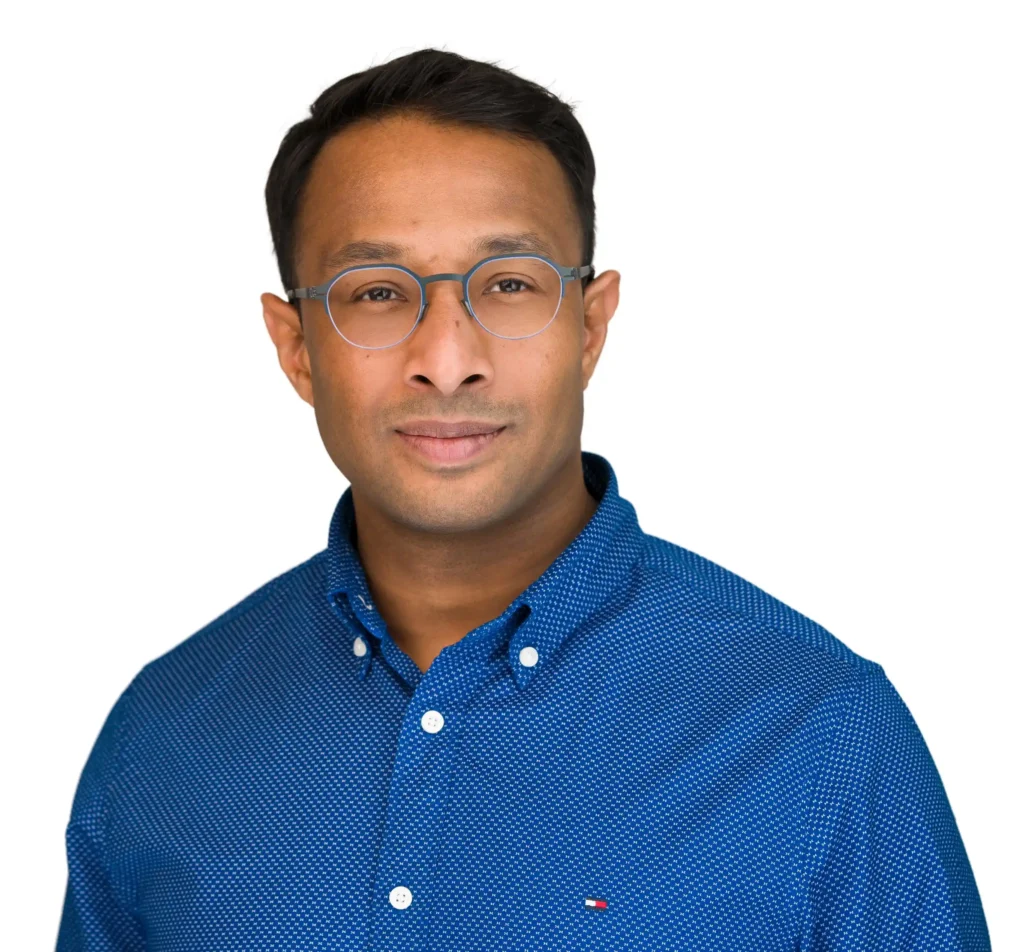 Samsung engineer searched for headshot photographer near me and worked with Headshot Specialist - Headshot Photographers NYC Ray Singh. He is wearing a blue shirt and has glasses