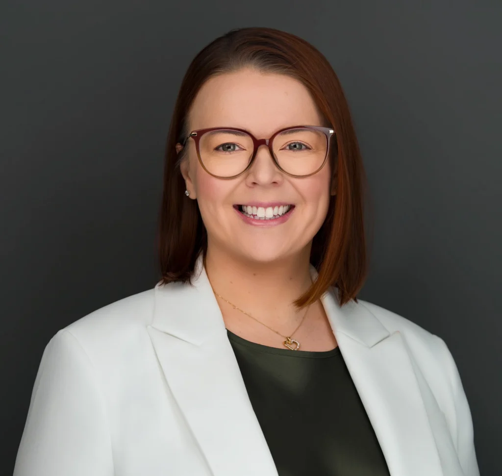 Female searched for headshot photographer near me and worked with Headshot Specialist - Headshot Photographers NYC Ray Singh. Female wearing a white blazer.